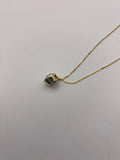 1 carat round brilliant solitaire bezel set solitaire in 14K solid yellow gold.