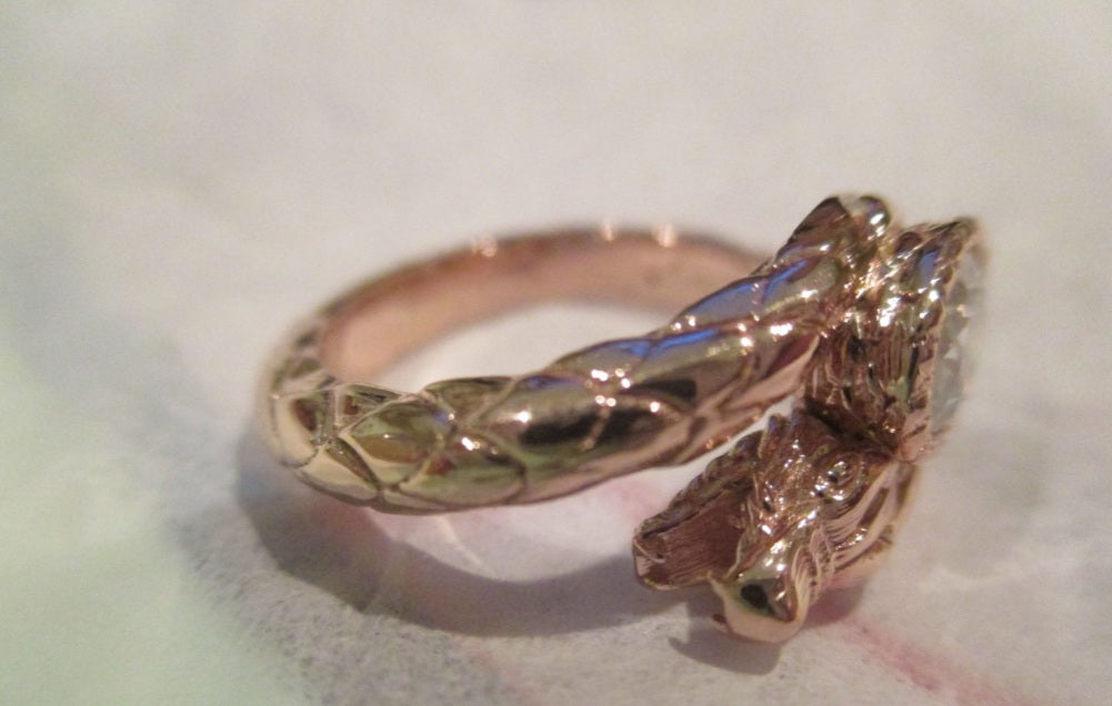 14k Gold fabulous Dragon Ring set with an Oval diamond or gemstone and a Ruby Accentcomes with an official game of Thrones hat